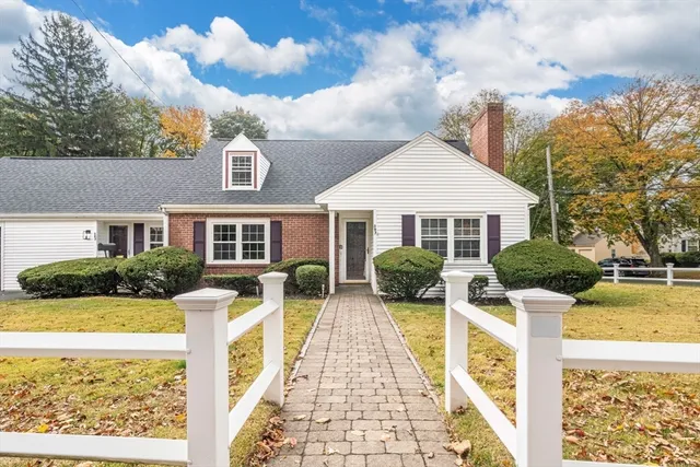 a view of house with yard outdoor seating