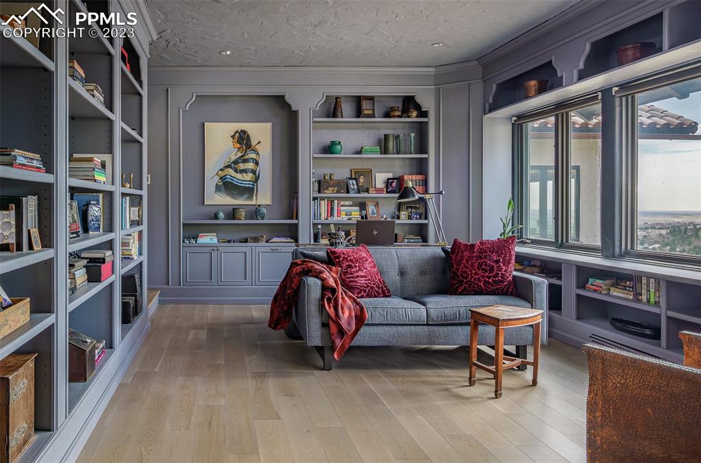 52 Marland Road Colorado Springs, CO 80906 - Photo 11 of 48 a living room with furniture and a book shelf