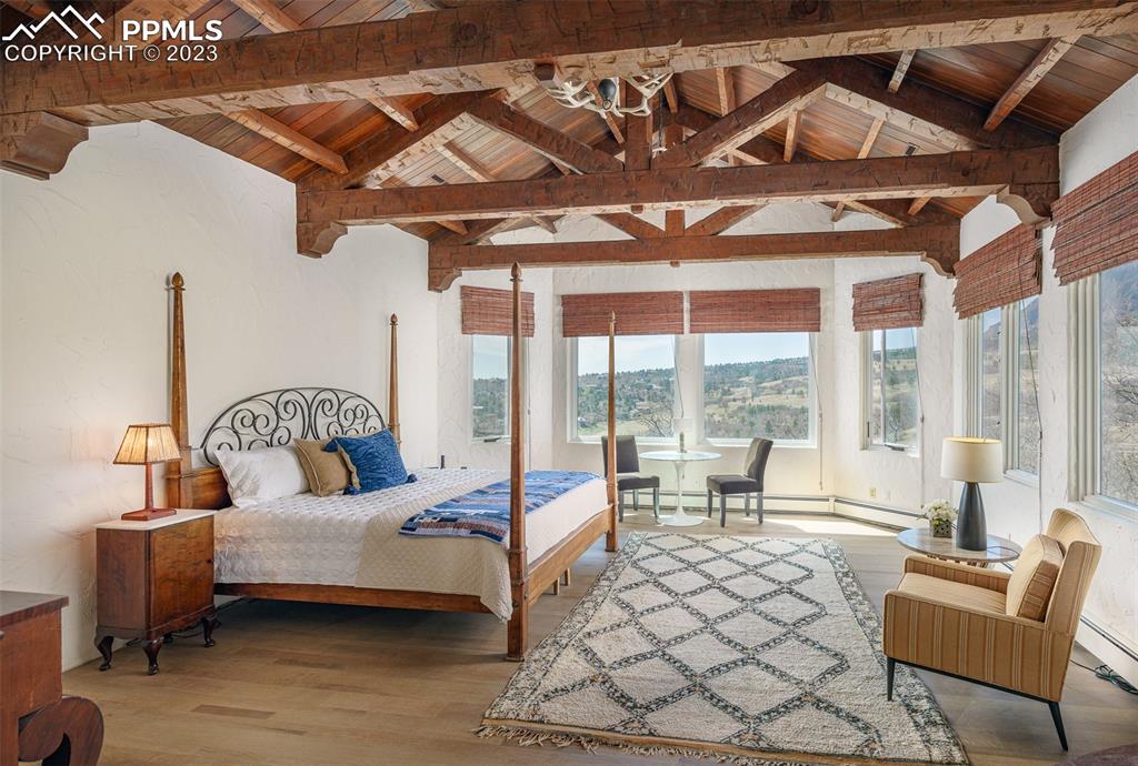 52 Marland Road Colorado Springs, CO 80906 - Photo 12 of 48 a spacious bedroom with a bed and a large window