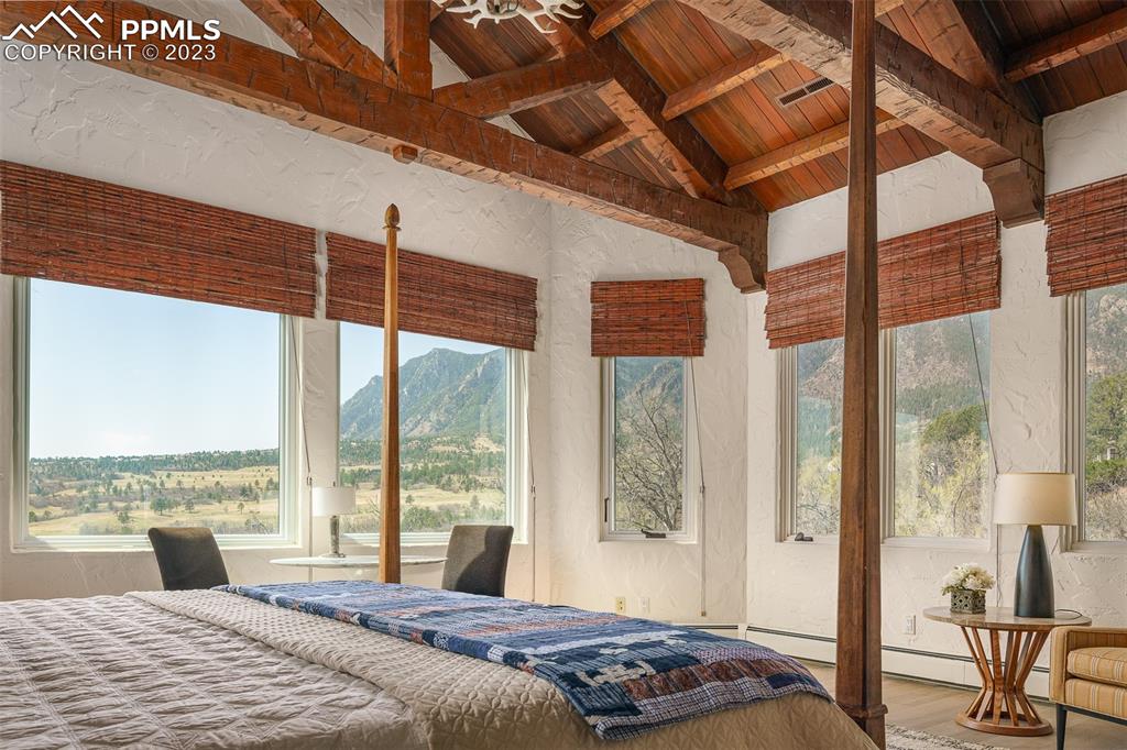 52 Marland Road Colorado Springs, CO 80906 - Photo 13 of 48 a bedroom with a large bed and a large window