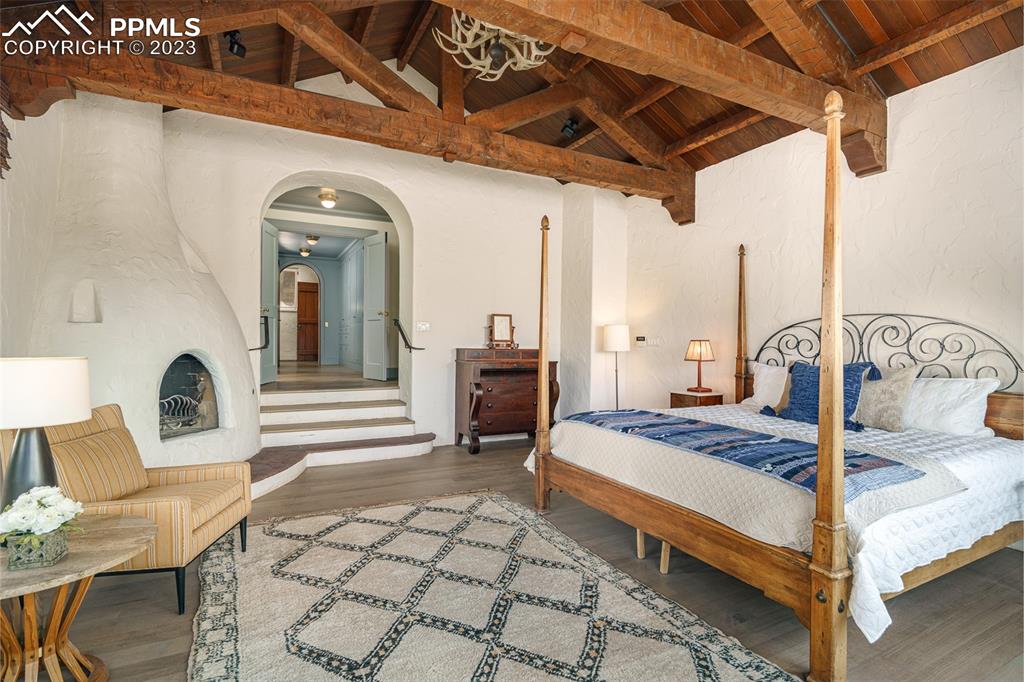 52 Marland Road Colorado Springs, CO 80906 - Photo 14 of 48 a bed room with a bed and a chair