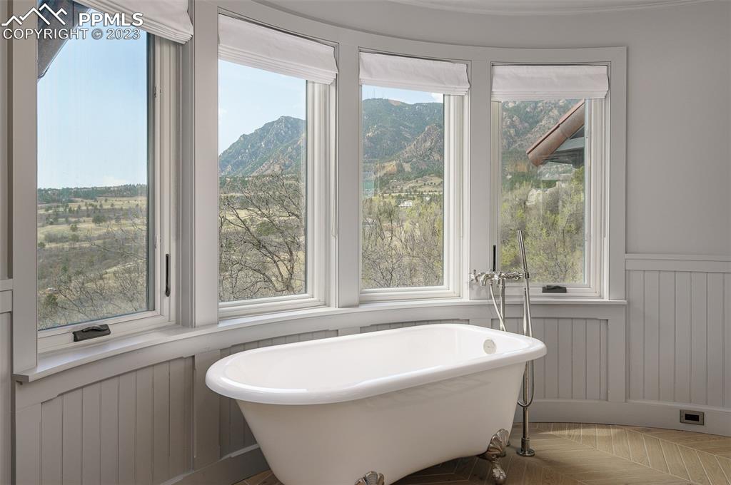 52 Marland Road Colorado Springs, CO 80906 - Photo 15 of 48 a white bath tub sitting in a bathroom next to a window