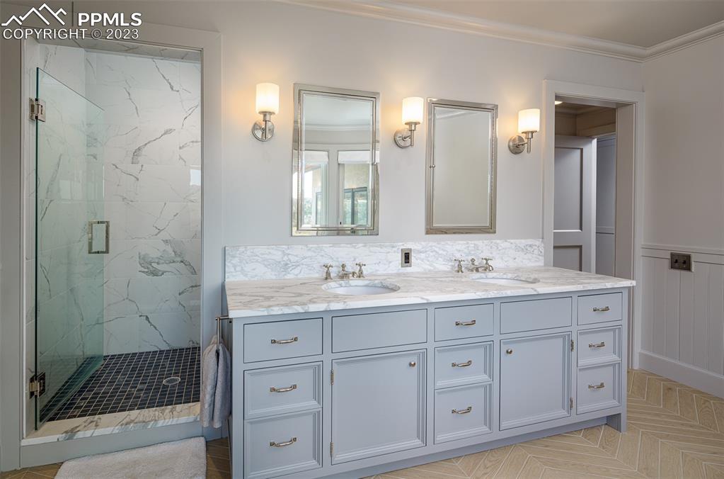 52 Marland Road Colorado Springs, CO 80906 - Photo 16 of 48 a bathroom with a granite countertop sink mirror and shower