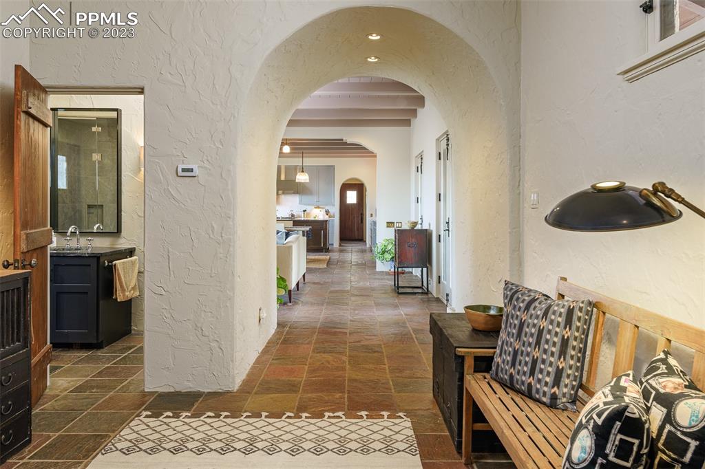 52 Marland Road Colorado Springs, CO 80906 - Photo 18 of 48 a view of a hallway with wooden floor and furniture
