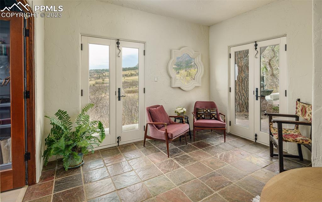 52 Marland Road Colorado Springs, CO 80906 - Photo 19 of 48 a living room with furniture and a potted plant