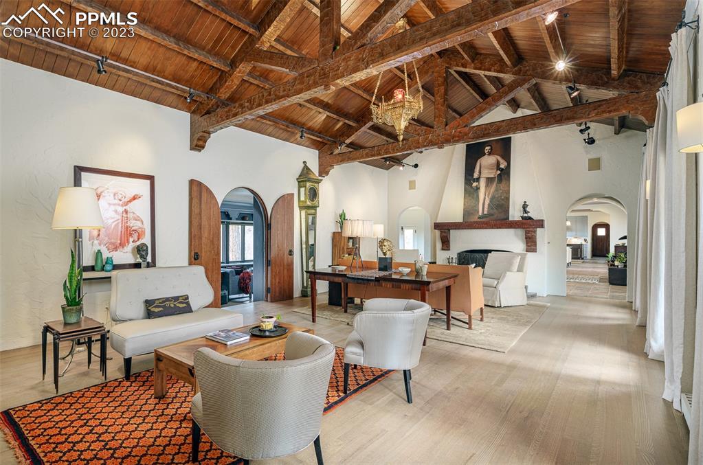 52 Marland Road Colorado Springs, CO 80906 - Photo 2 of 48 a living room with fireplace furniture and a chandelier
