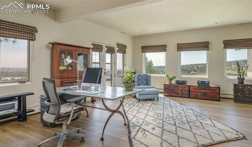52 Marland Road Colorado Springs, CO 80906 - Photo 21 of 48 a dining room with furniture and wooden floor