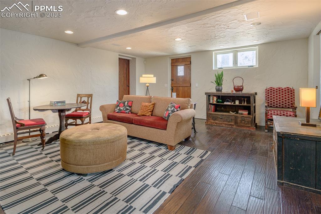 52 Marland Road Colorado Springs, CO 80906 - Photo 27 of 48 a living room with furniture and a wooden floor
