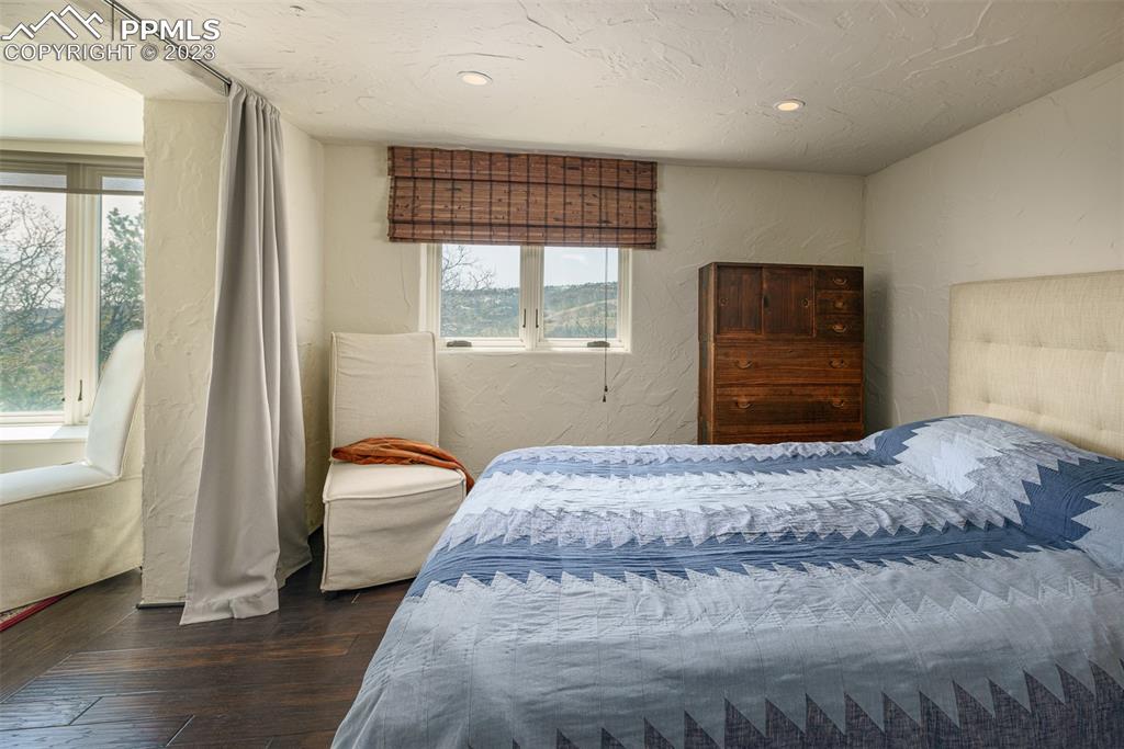 52 Marland Road Colorado Springs, CO 80906 - Photo 29 of 48 a bedroom with a bed and a dresser