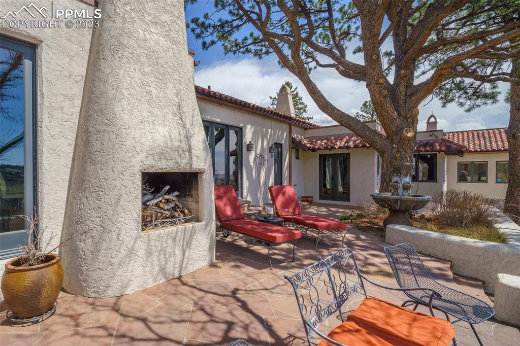 52 Marland Road Colorado Springs, CO 80906 - Photo 37 of 48 a building outdoor space with patio furniture and potted plants
