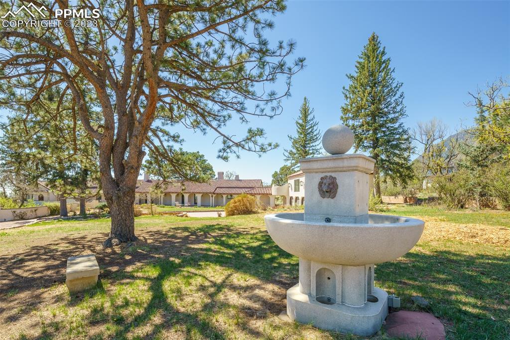 52 Marland Road Colorado Springs, CO 80906 - Photo 42 of 48 a front view of a house with garden and trees