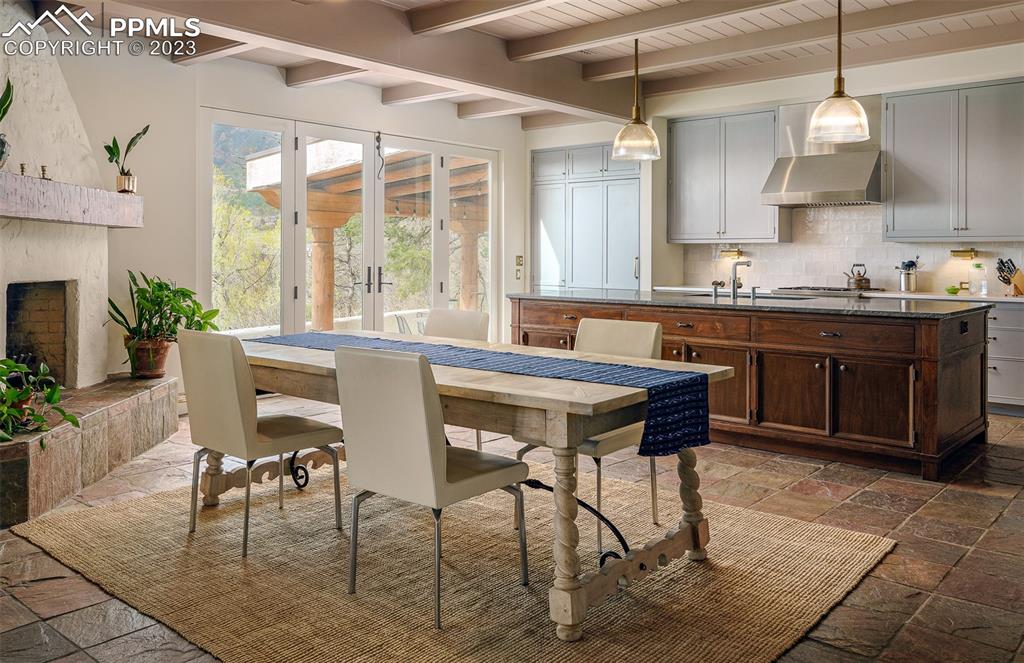 52 Marland Road Colorado Springs, CO 80906 - Photo 6 of 48 a kitchen with stainless steel appliances granite countertop table chairs sink and cabinets
