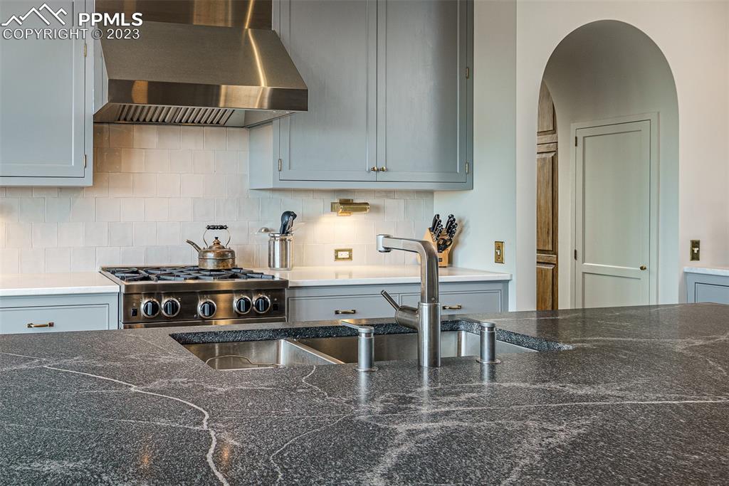 52 Marland Road Colorado Springs, CO 80906 - Photo 8 of 48 a kitchen with stainless steel appliances granite countertop a stove a sink and a cabinets