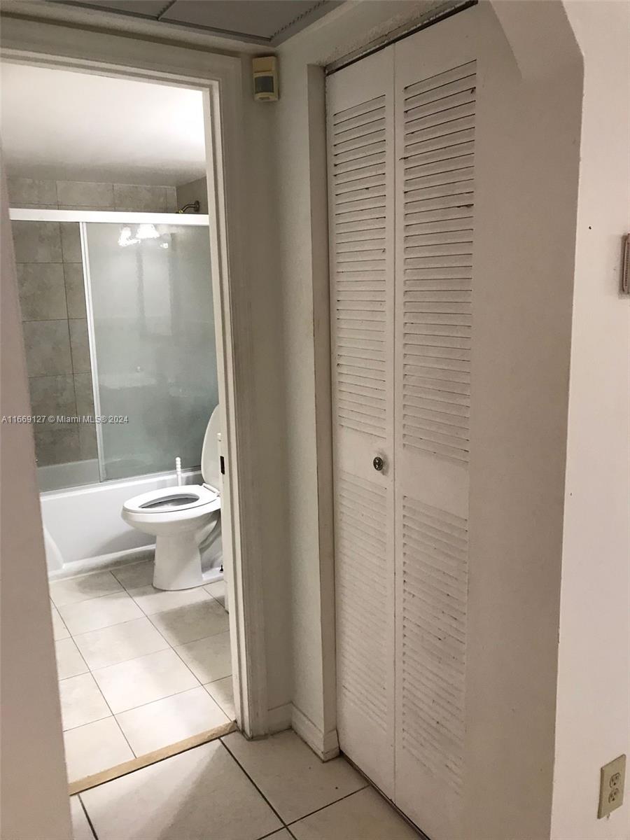423 Northeast 210th Cir Terrace, Unit 10425 Miami, FL 33179 - Photo 16 of 37 a bathroom with a toilet and a shower