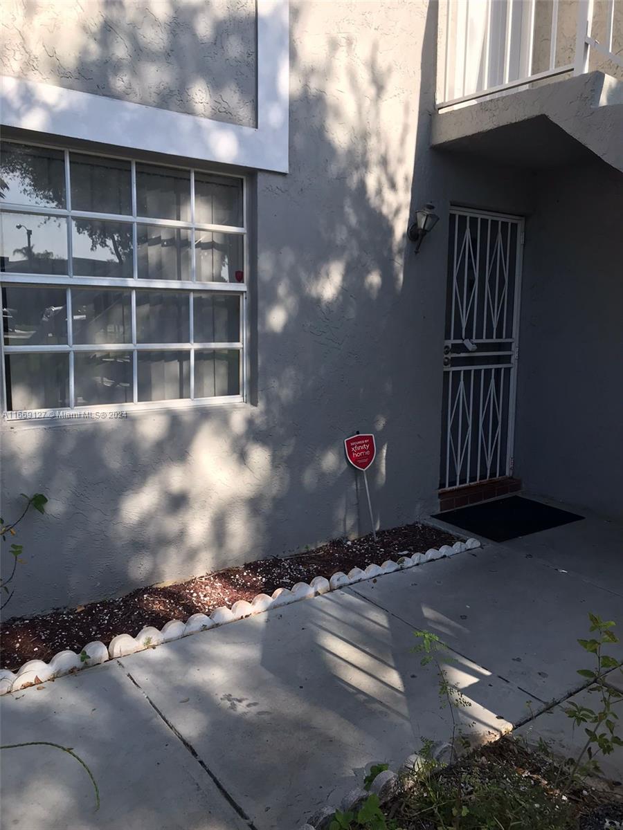 423 Northeast 210th Cir Terrace, Unit 10425 Miami, FL 33179 - Photo 18 of 37 a view of street from balcony