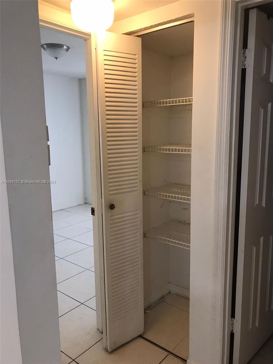 423 Northeast 210th Cir Terrace, Unit 10425 Miami, FL 33179 - Photo 21 of 37 a bathroom with a glass door shower