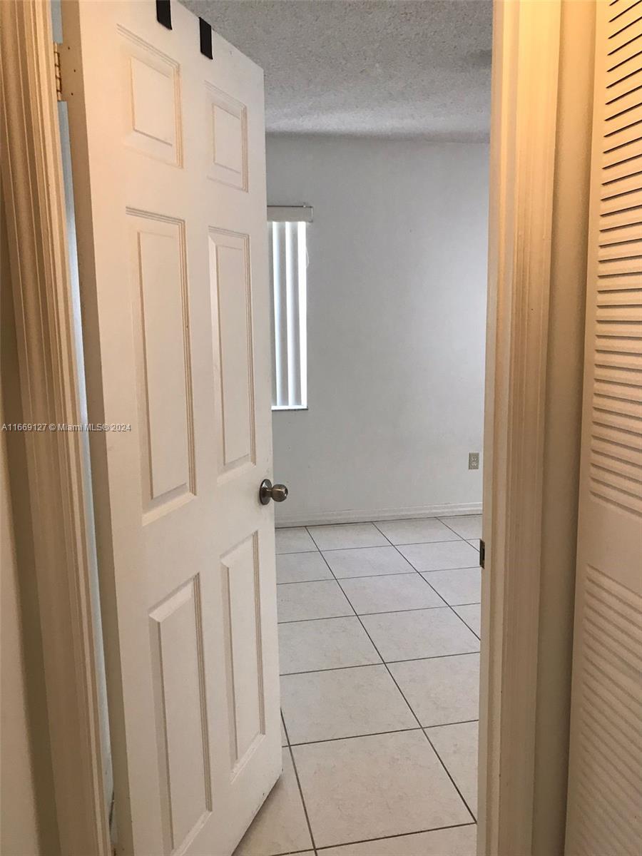 423 Northeast 210th Cir Terrace, Unit 10425 Miami, FL 33179 - Photo 22 of 37 a view of a livingroom with wooden floor