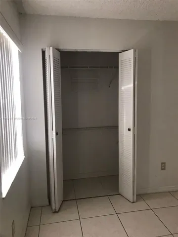 a view of bathroom with a shower and a sink