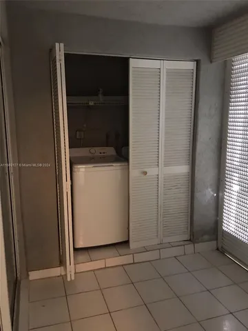 a utility room with washer and dryer