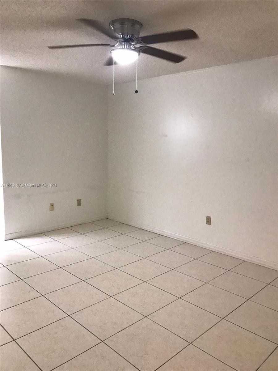 423 Northeast 210th Cir Terrace, Unit 10425 Miami, FL 33179 - Photo 31 of 37 a view of an empty room