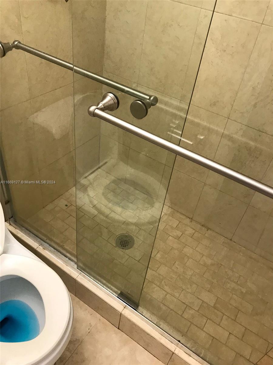 423 Northeast 210th Cir Terrace, Unit 10425 Miami, FL 33179 - Photo 34 of 37 a bathroom with a shower