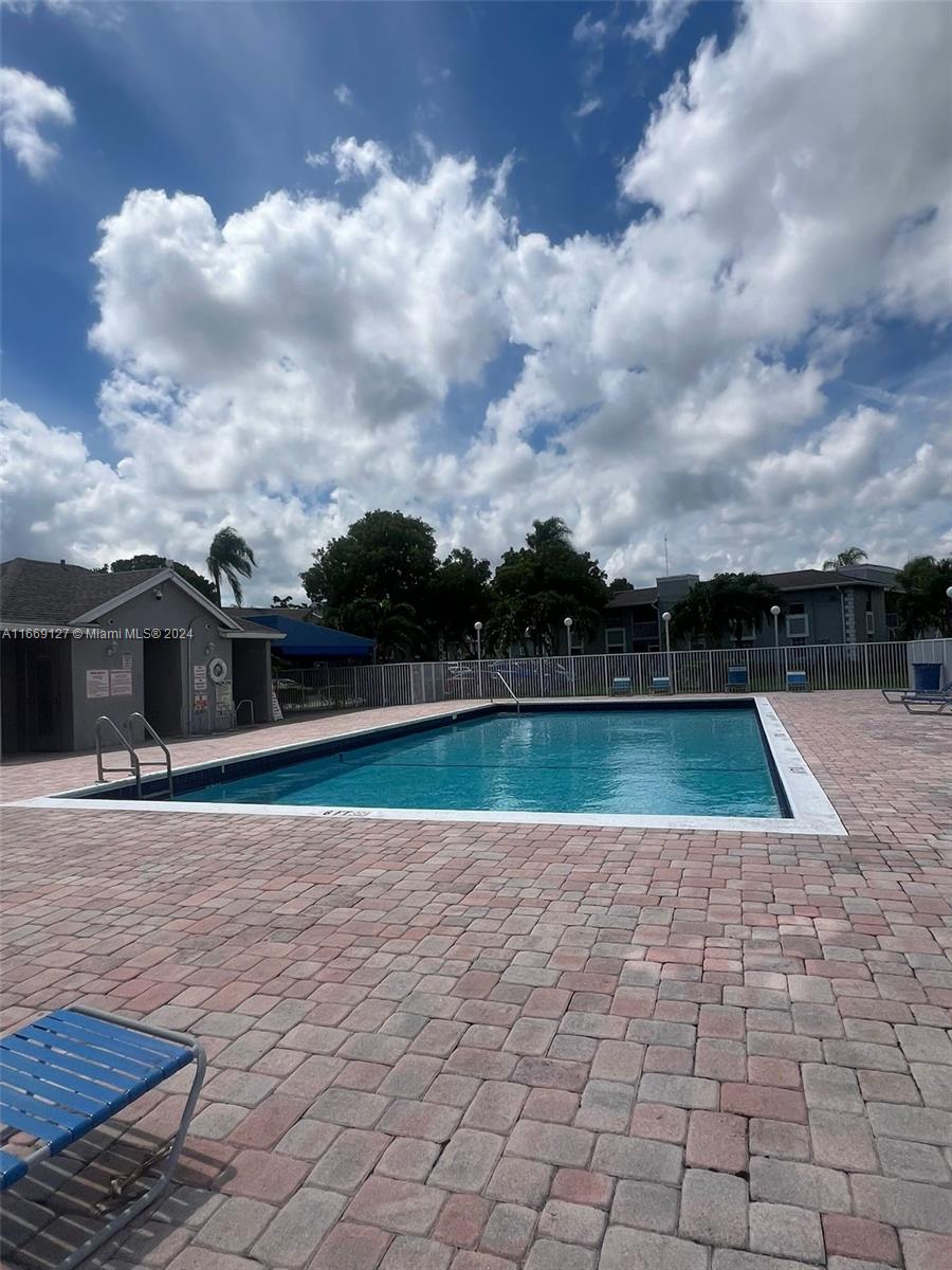 423 Northeast 210th Cir Terrace, Unit 10425 Miami, FL 33179 - Photo 4 of 37 a view of swimming pool with a yard