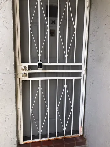 an empty room with closet and windows