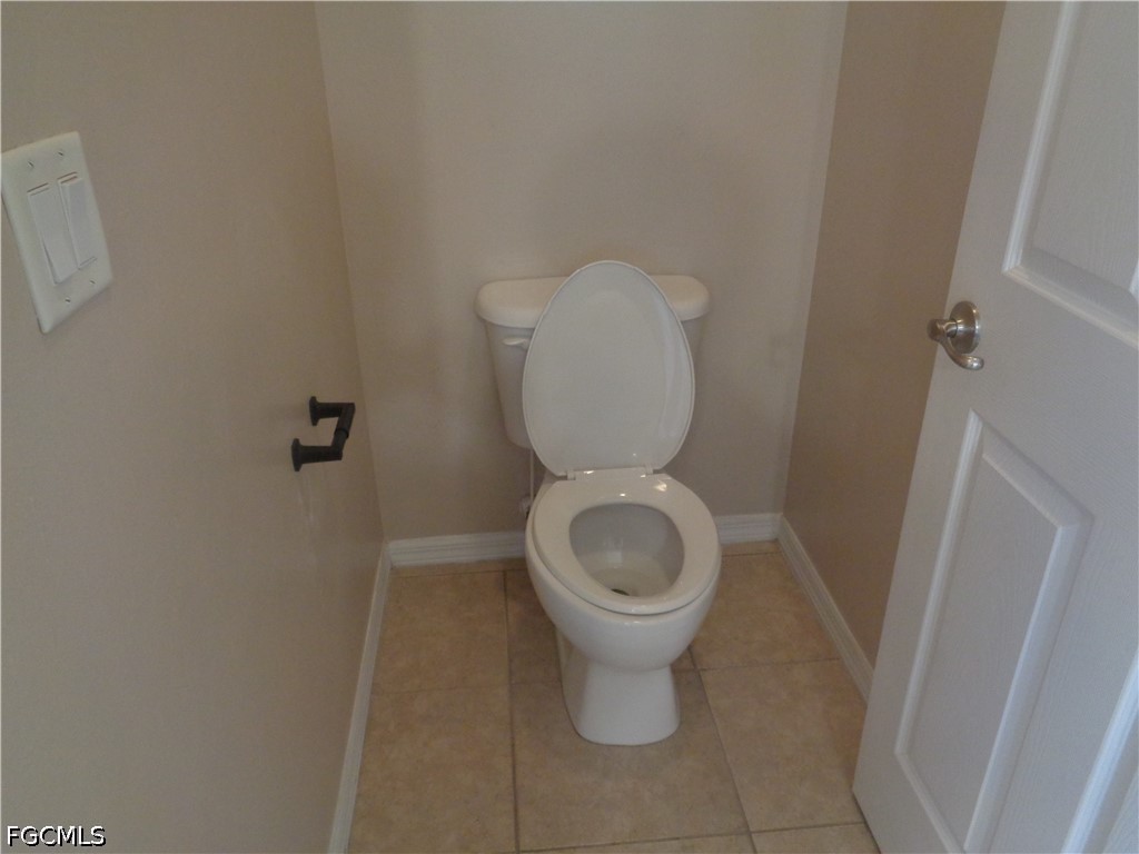 2463 Nature Pointe Loop Fort Myers, FL 33905 - Photo 25 of 50 a bathroom with a toilet and a sink