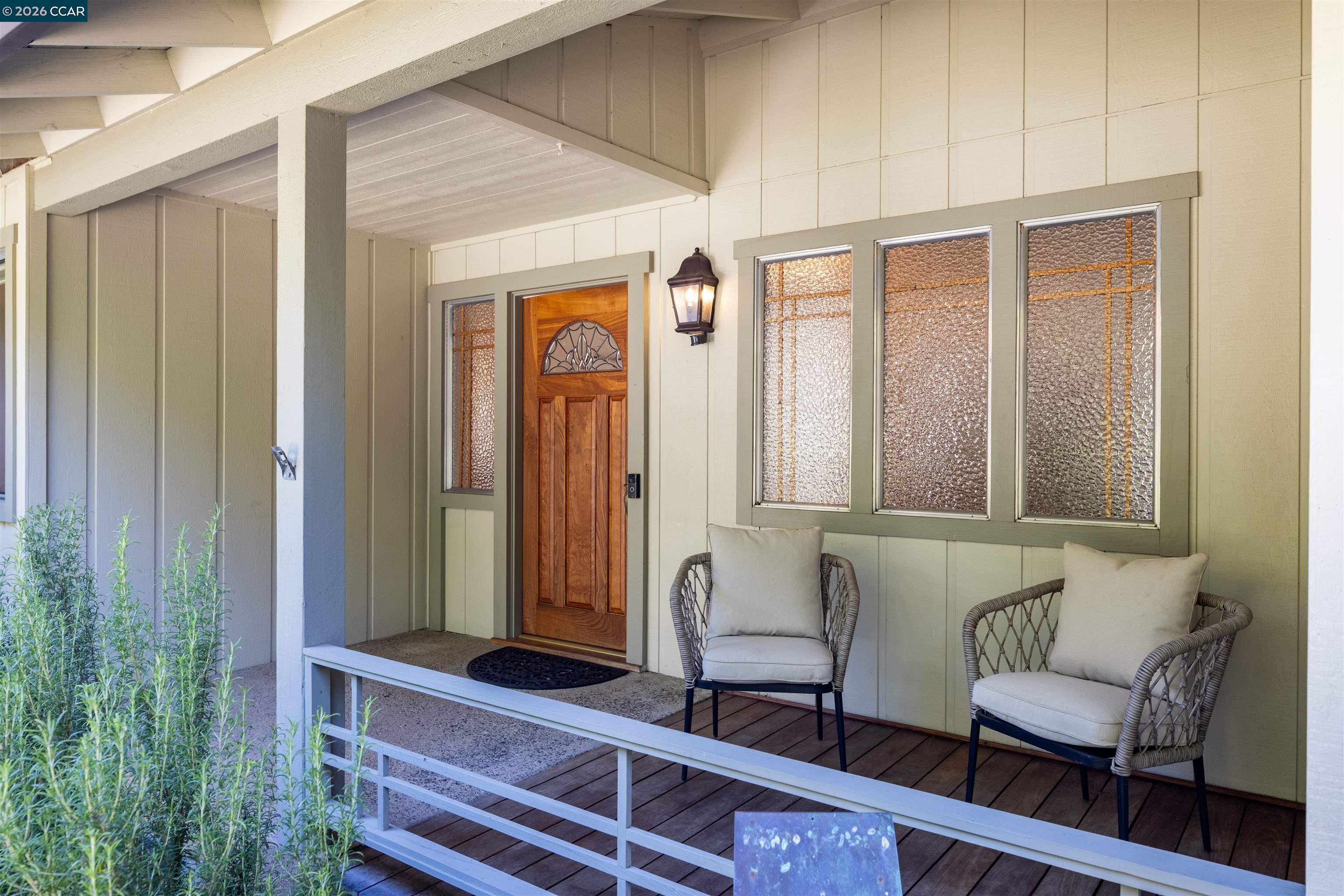 12 Marquard Road Carmel Valley, CA 93924 - Photo 8 of 36 a view of a door and chair in the room