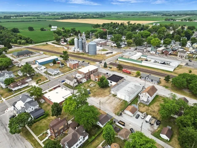 an aerial view of residential house with outdoor space and city view