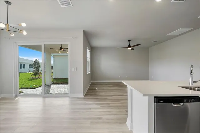 a view of a kitchen with a sink and a kitchen view