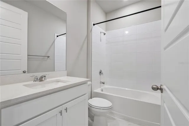 a bathroom with a sink a toilet and a bathtub