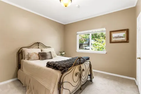 a bedroom with a bed and window
