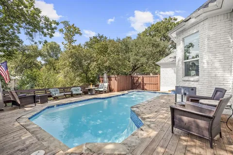 a view of a patio with couple of chairs