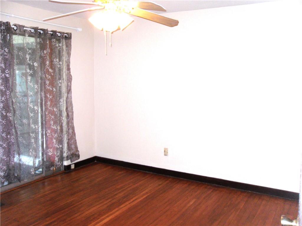 419 Streets Run Road Pittsburgh, PA 15236 - Photo 14 of 46 a view of a room with wooden floor and large window