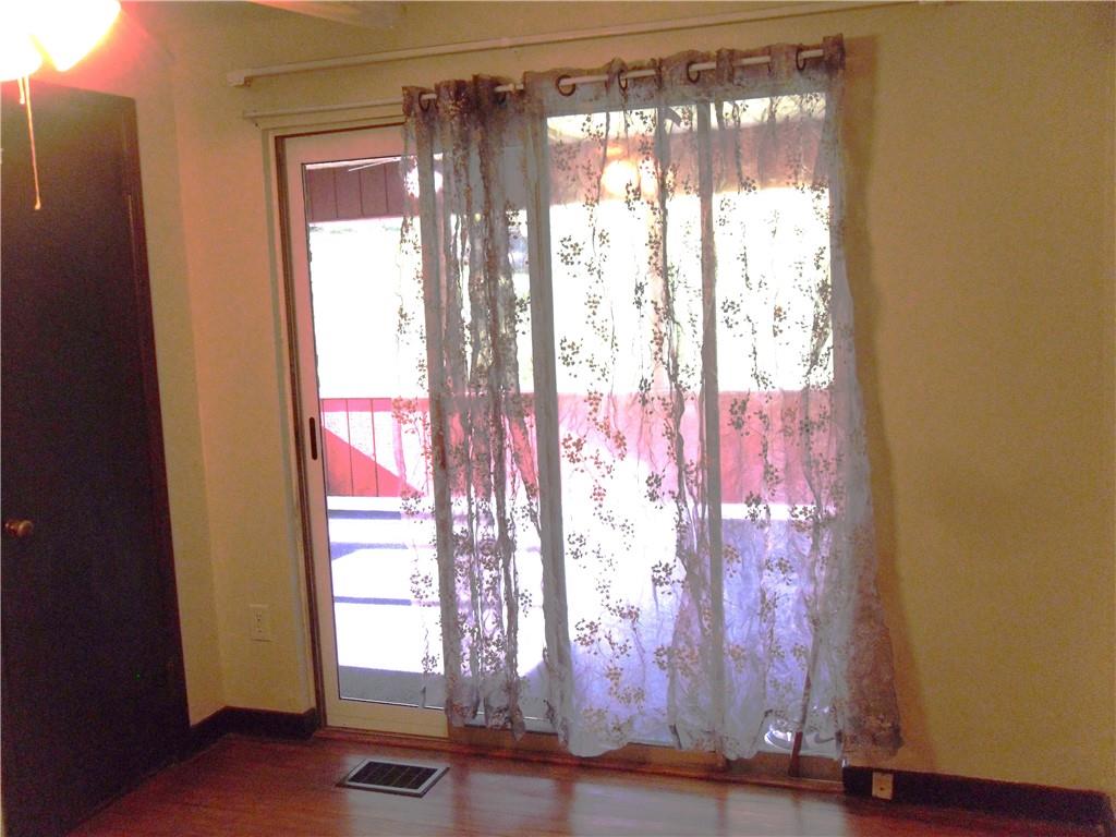 419 Streets Run Road Pittsburgh, PA 15236 - Photo 15 of 46 a room with window and wooden floor