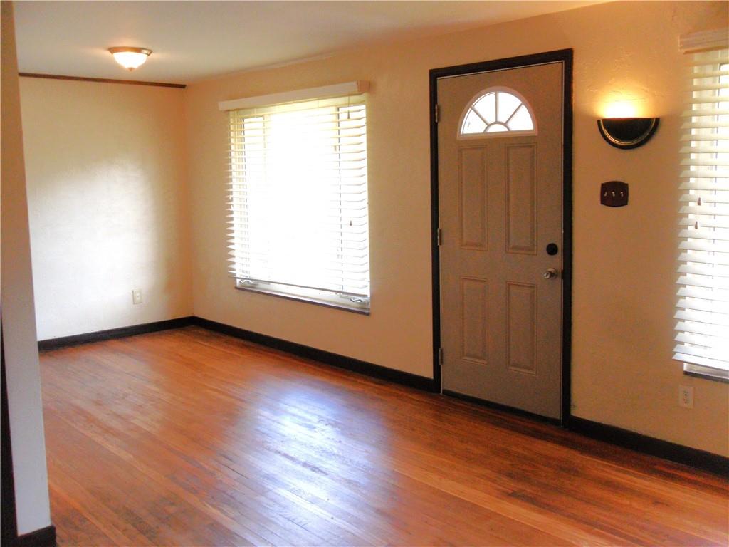 419 Streets Run Road Pittsburgh, PA 15236 - Photo 19 of 46 an empty room with wooden floor closet and windows