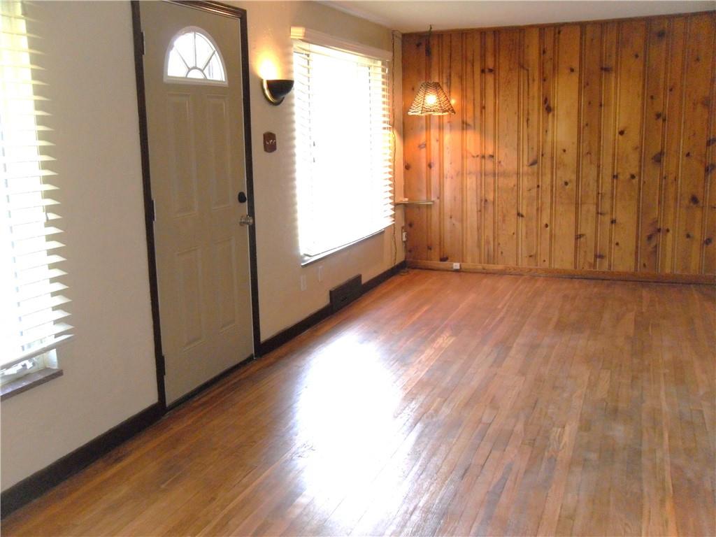 419 Streets Run Road Pittsburgh, PA 15236 - Photo 20 of 46 a view of an empty room with wooden floor and a window