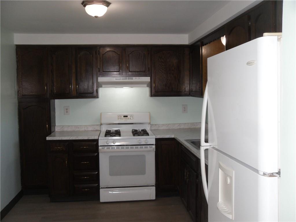 419 Streets Run Road Pittsburgh, PA 15236 - Photo 2 of 46 a kitchen with a stove and a refrigerator