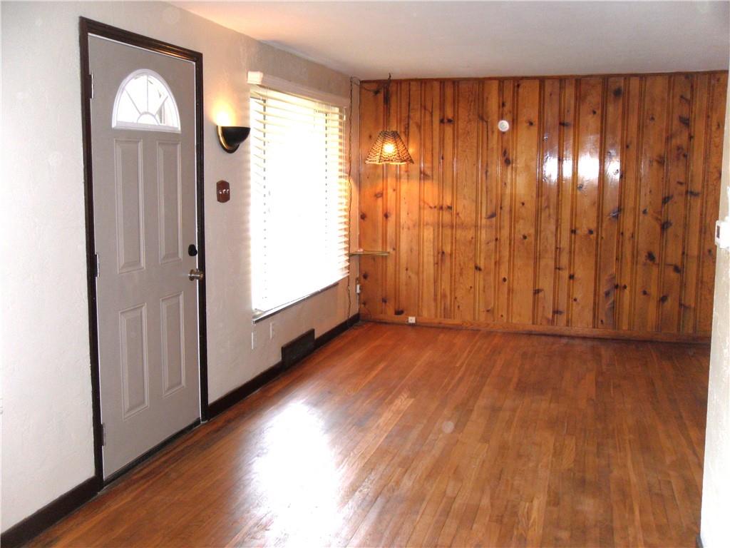 419 Streets Run Road Pittsburgh, PA 15236 - Photo 21 of 46 an empty room with wooden floor and windows