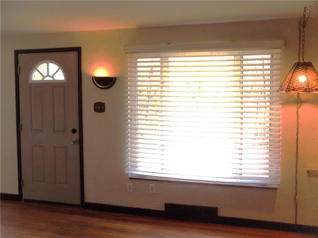 419 Streets Run Road Pittsburgh, PA 15236 - Photo 23 of 46 an empty room with wooden floor and windows