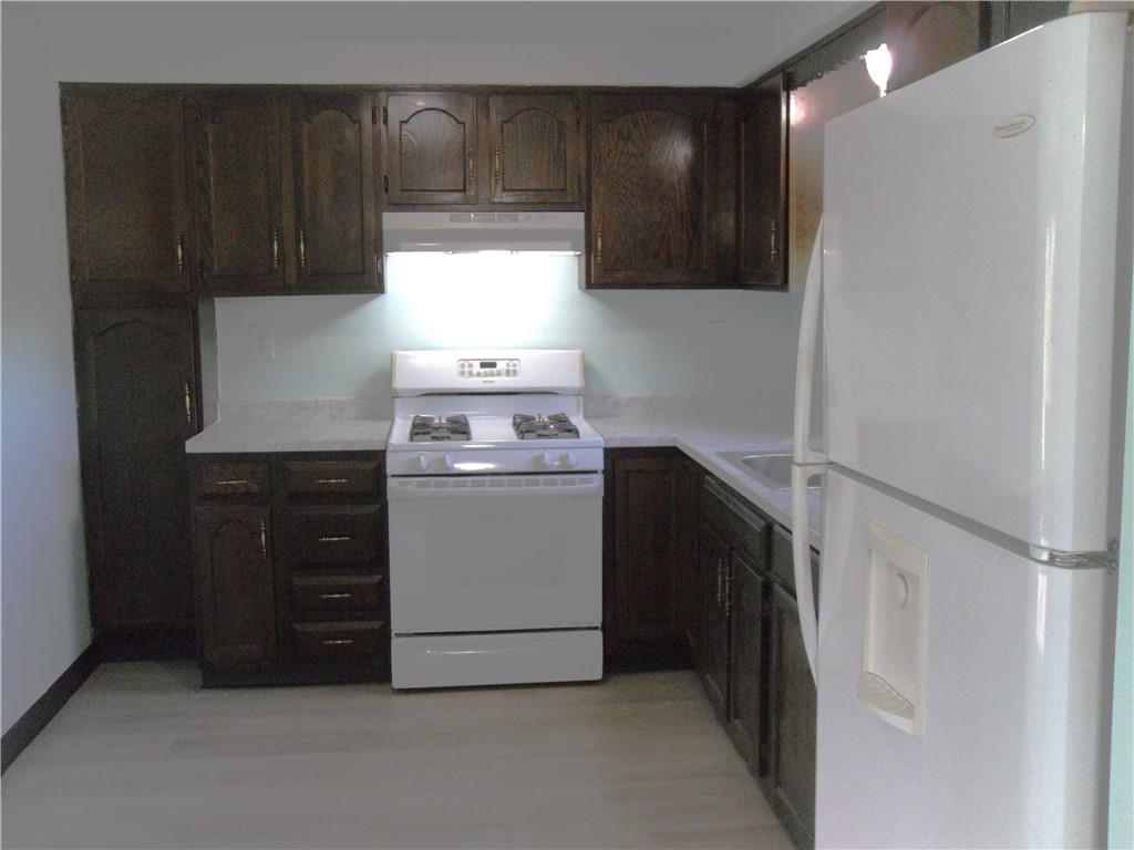 419 Streets Run Road Pittsburgh, PA 15236 - Photo 3 of 46 a kitchen with a stove and a refrigerator