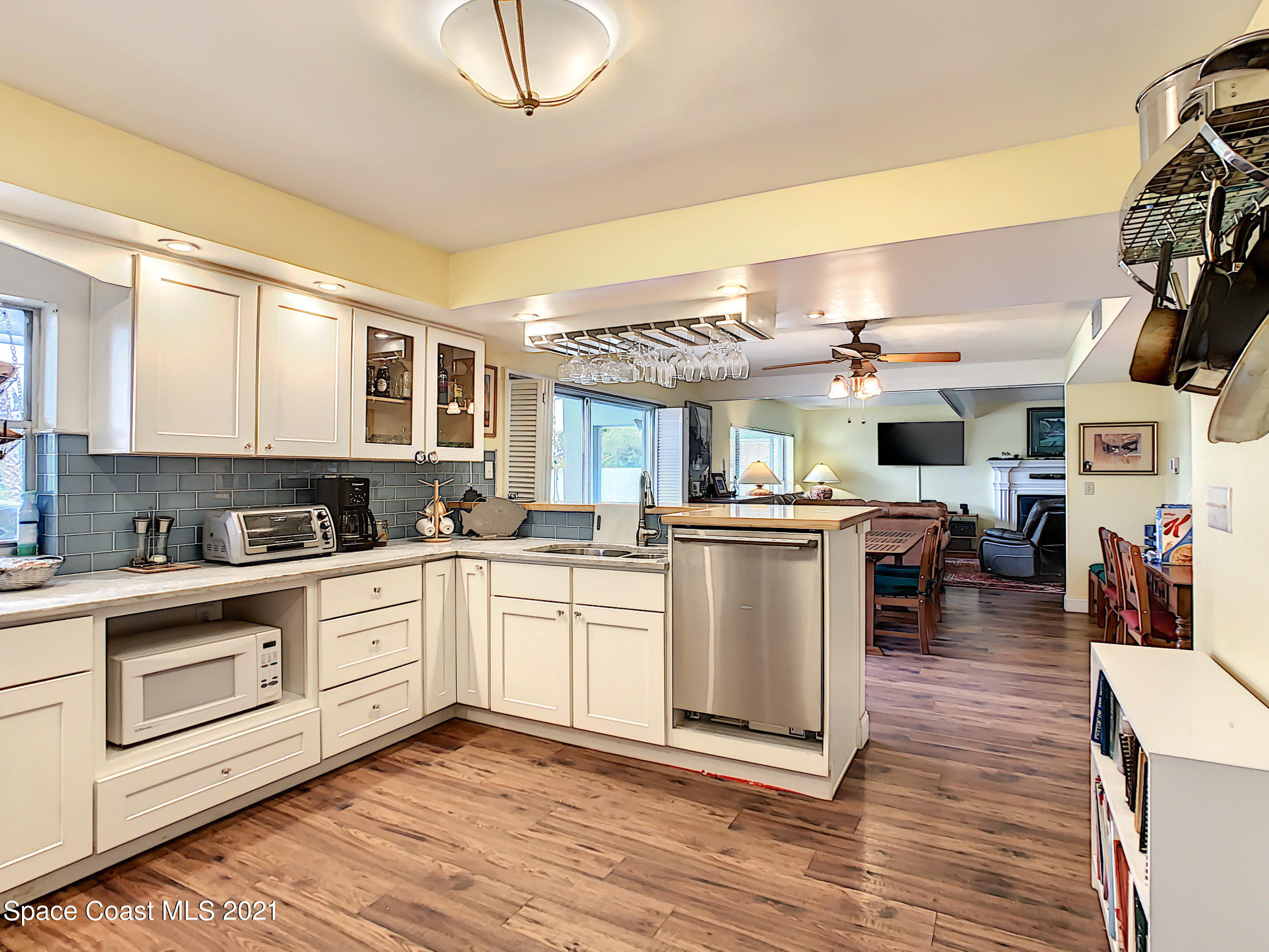 738 Nassau Road Cocoa Beach, FL 32931 - Photo 11 of 26 a kitchen with stainless steel appliances granite countertop a stove and cabinets