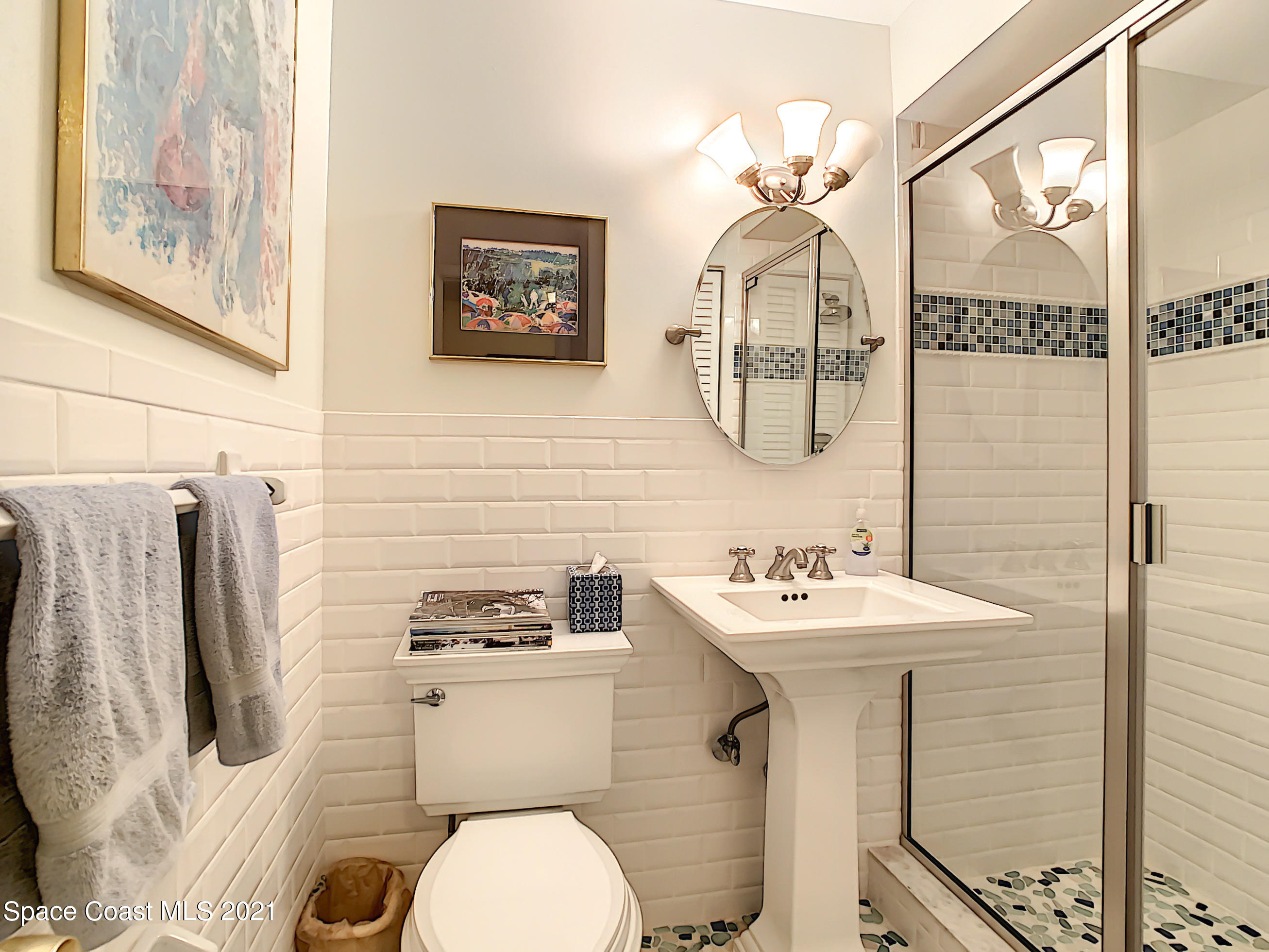738 Nassau Road Cocoa Beach, FL 32931 - Photo 15 of 26 a bathroom with a sink mirror and toilet