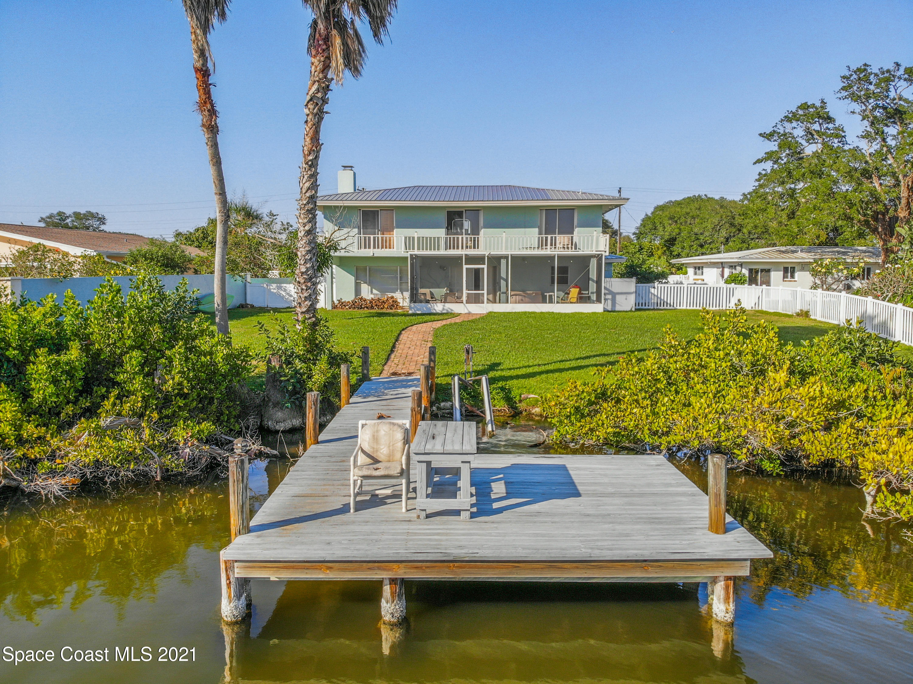 738 Nassau Road Cocoa Beach, FL 32931 - Photo 20 of 26 a view of a lake with a house