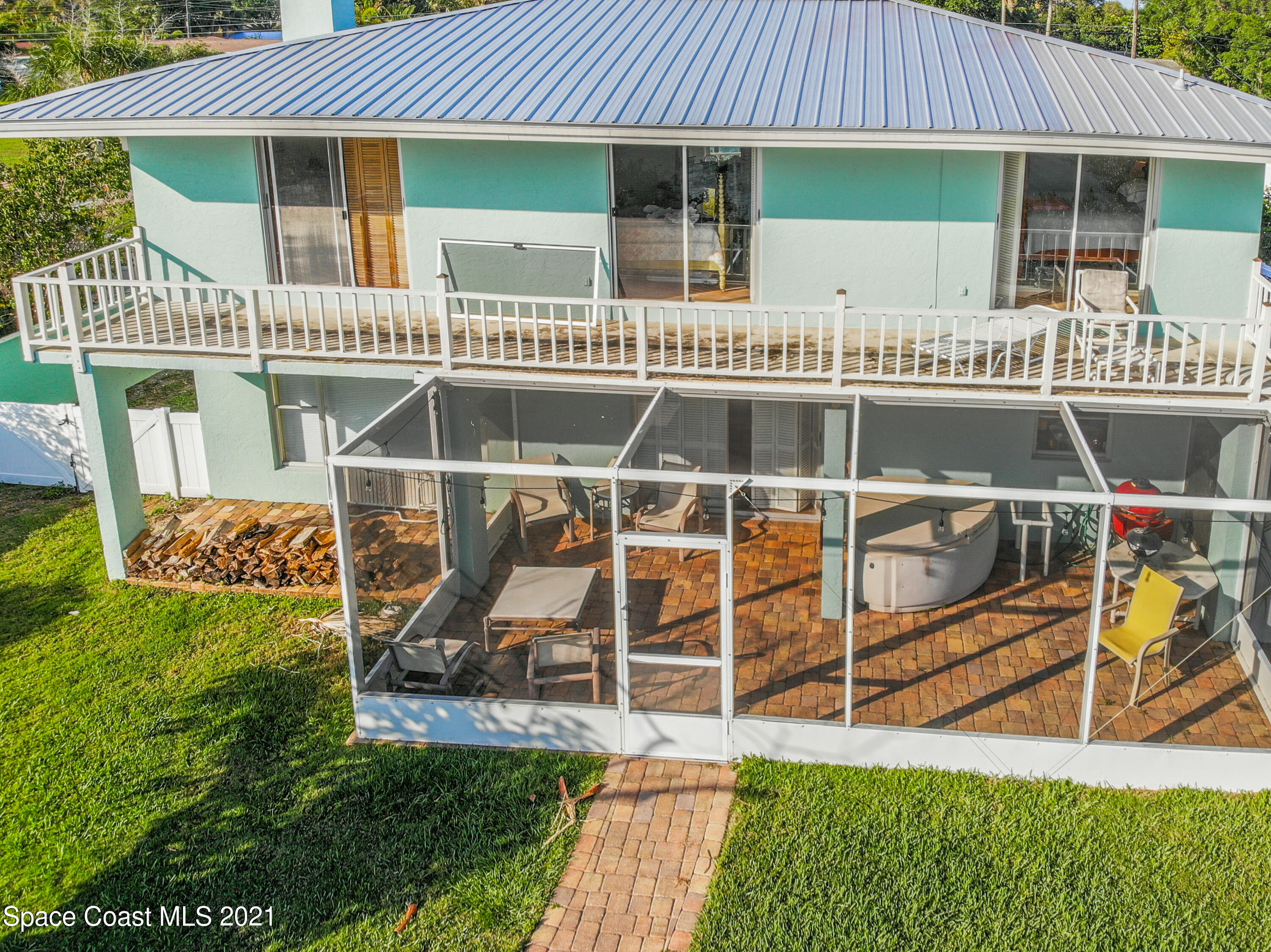 738 Nassau Road Cocoa Beach, FL 32931 - Photo 22 of 26 an outdoor view of house with swimming pool outdoor seating