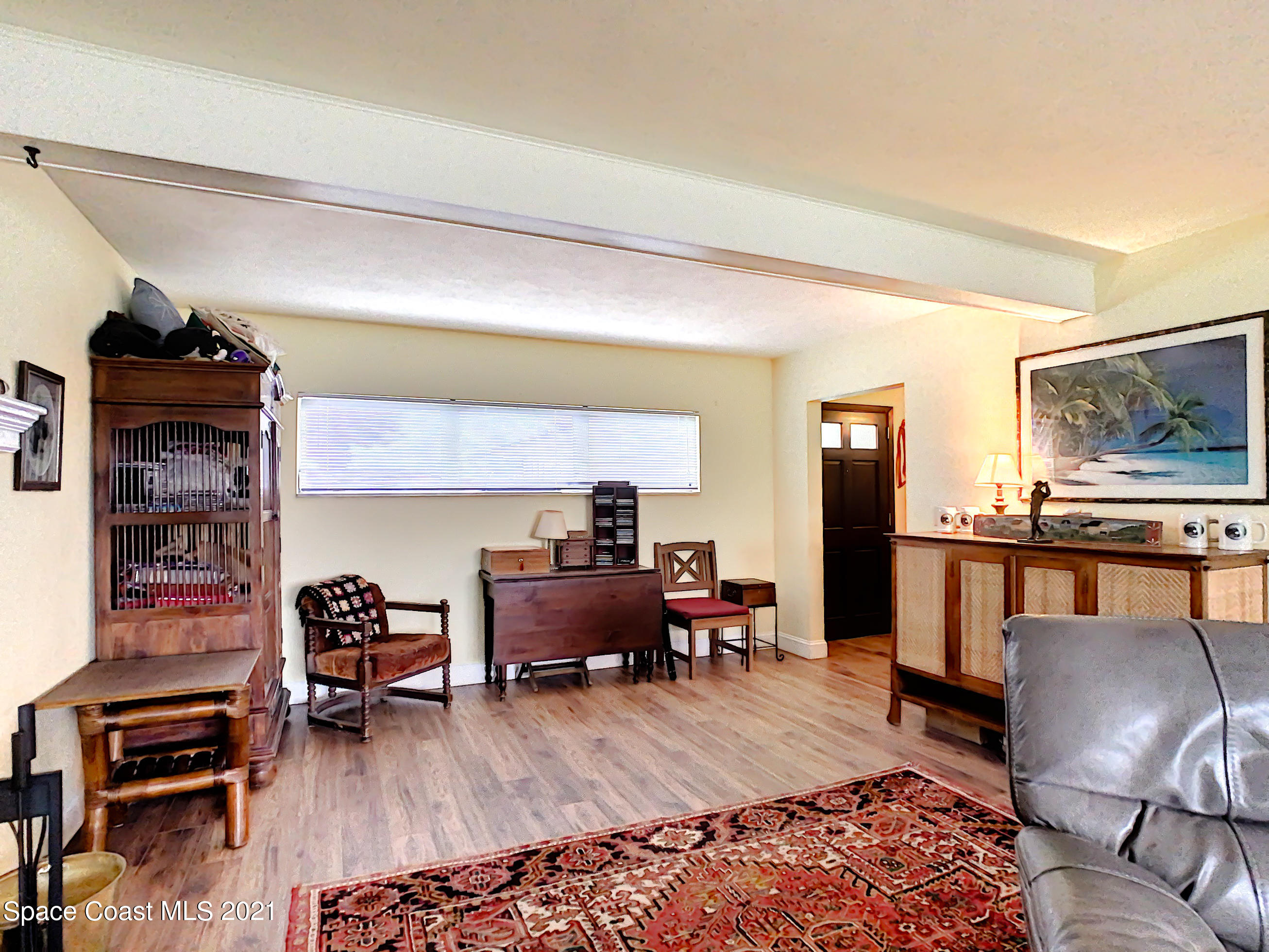 738 Nassau Road Cocoa Beach, FL 32931 - Photo 7 of 26 a living room with furniture and wooden floor