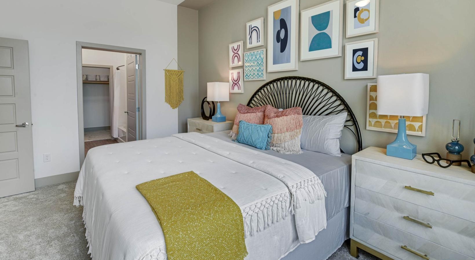 9330 South Main Street, Unit 332 Houston, TX 77025 - Photo 5 of 24 a bedroom with a bed and a mirror