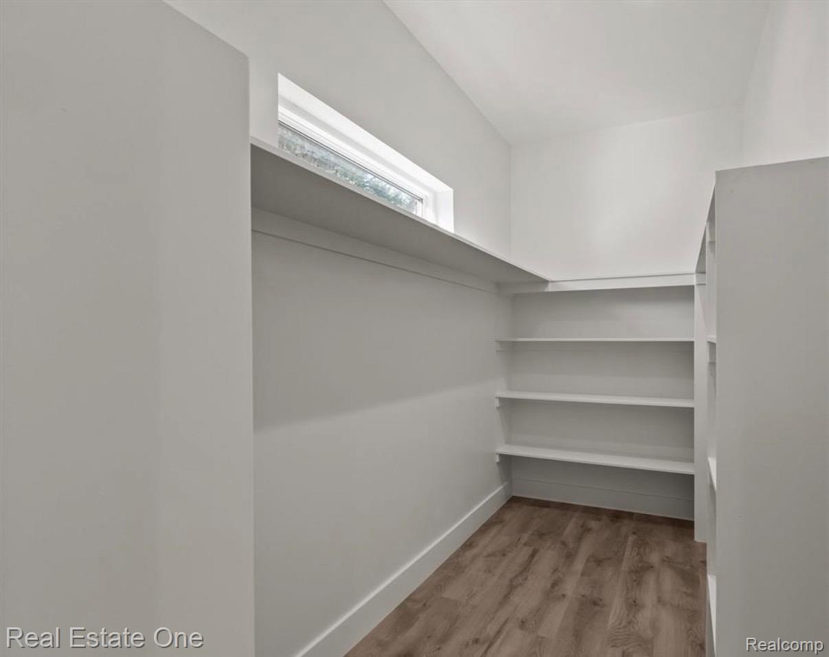 5636 Paris Street Sterling Heights, MI 48310 - Photo 18 of 37 Walk in closet featuring light wood-style floors