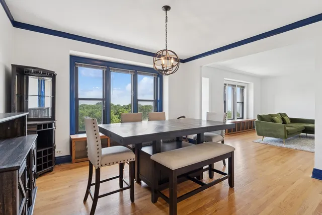 a view of a livingroom with furniture window and wooden floor